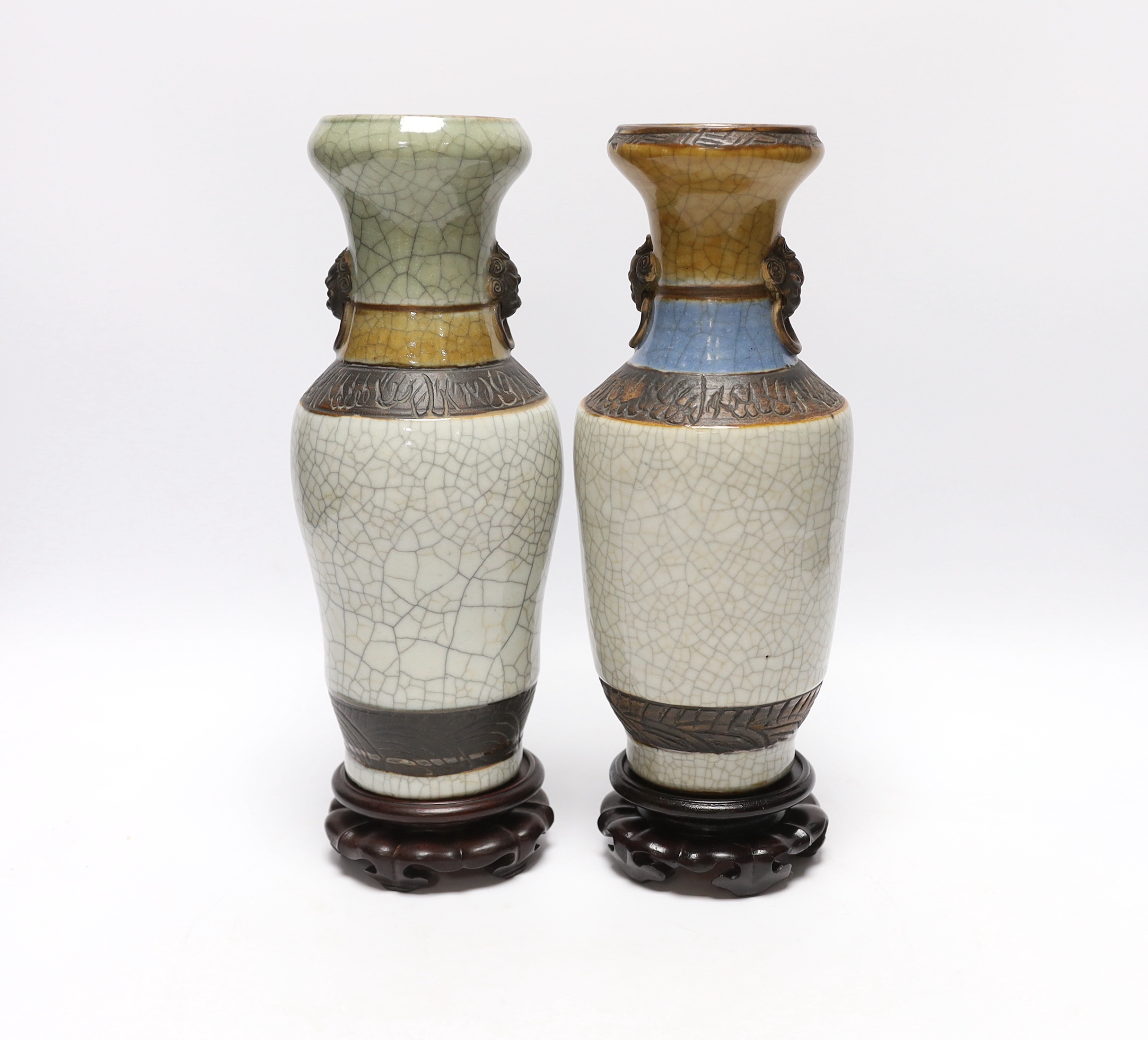 Two Chinese crackle glaze vases, Guanxu period, with stands, 25cm excluding stands